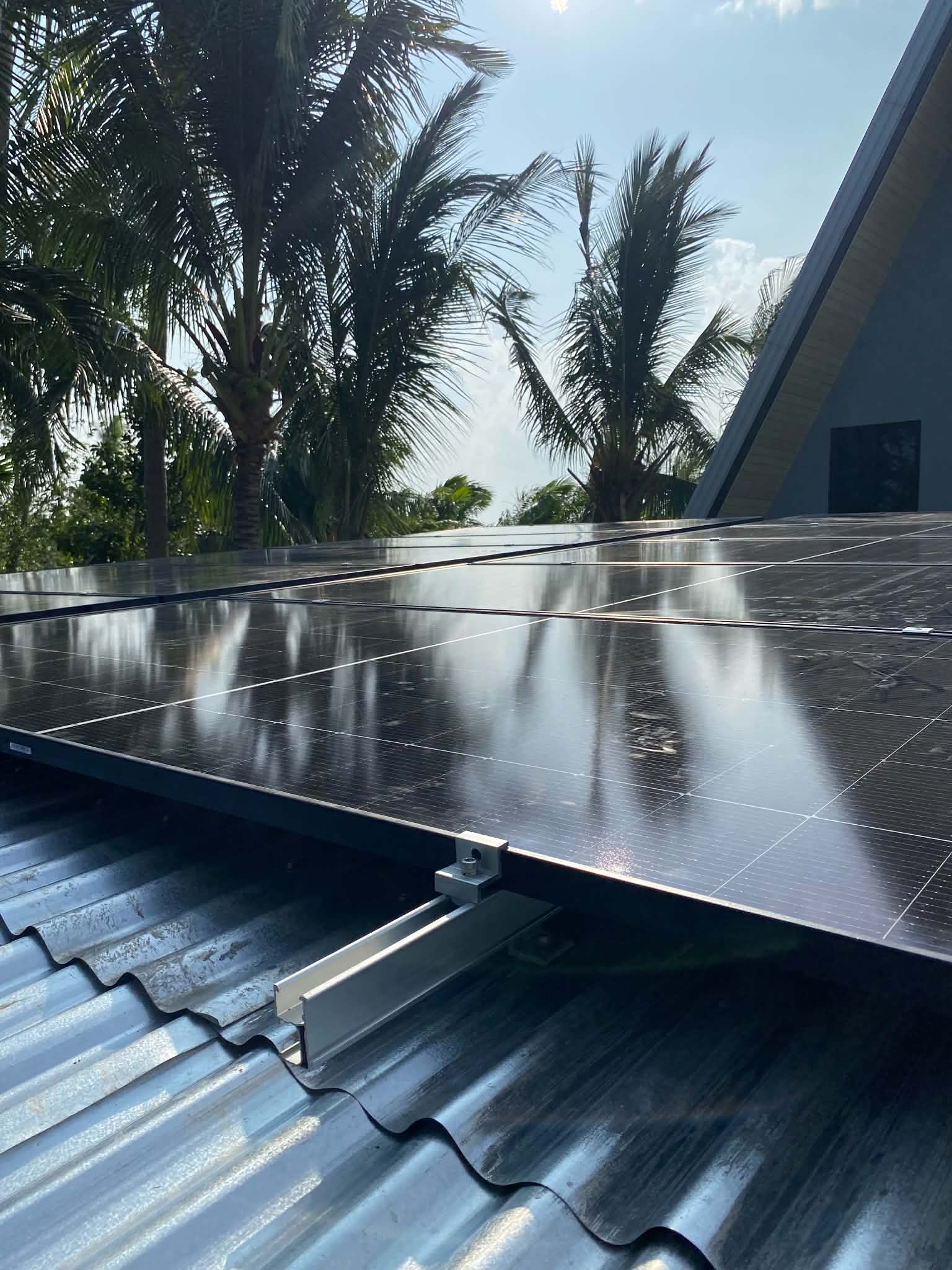 Solar panels mounted on a residential rooftop under a clear sky