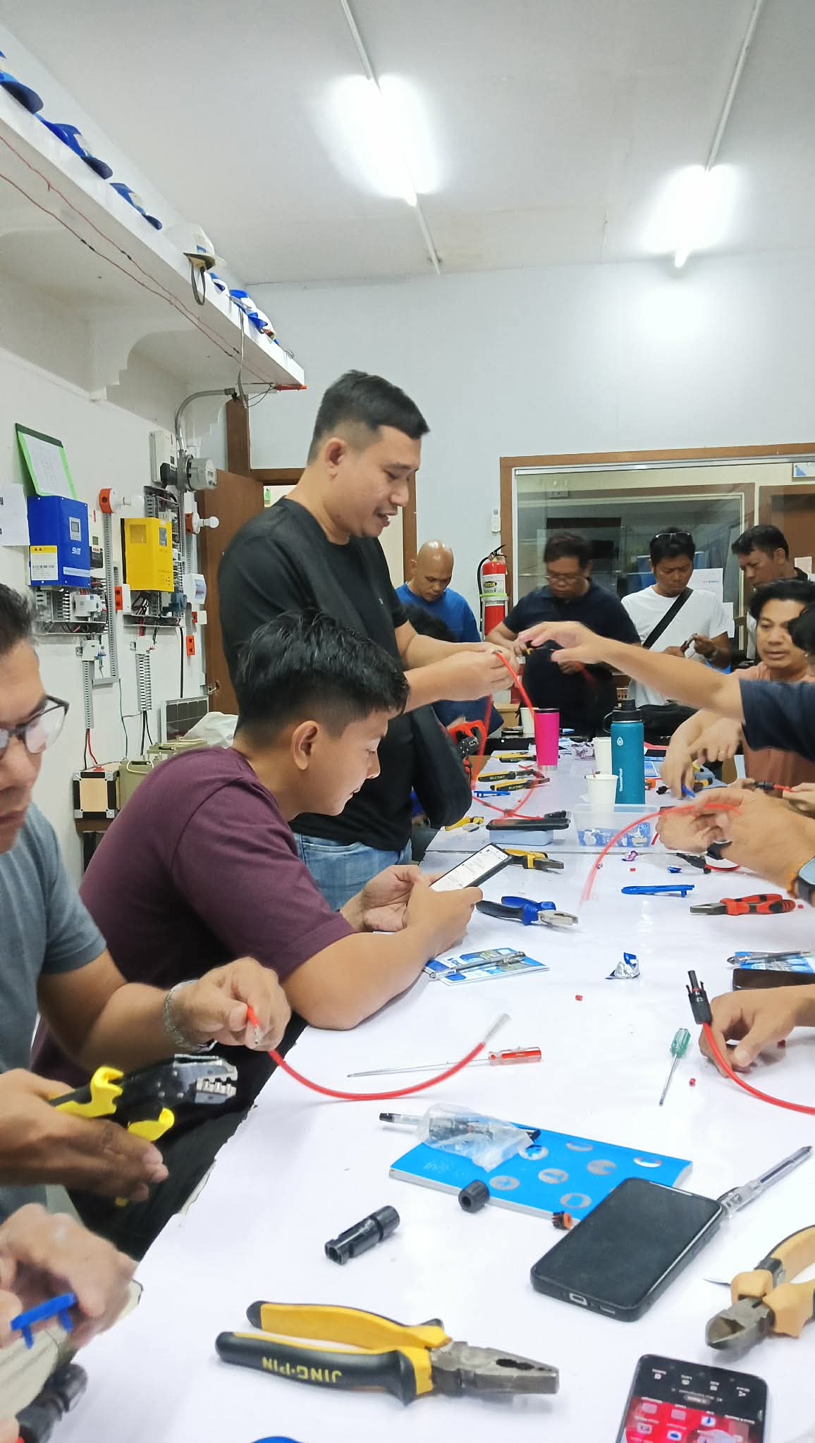 Participants working together during a practical solar training workshop
