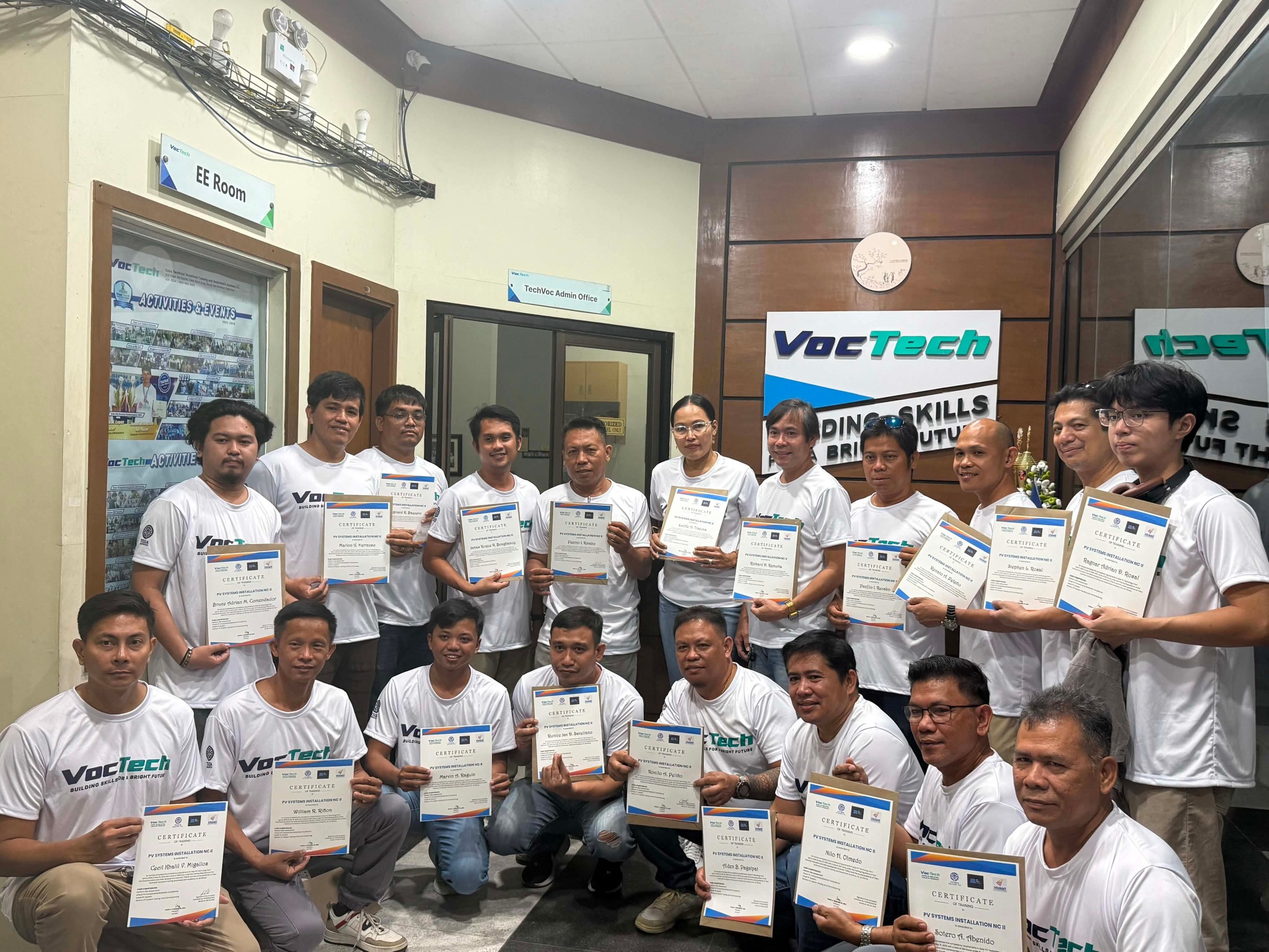 VocTech trainees holding certificates after their training